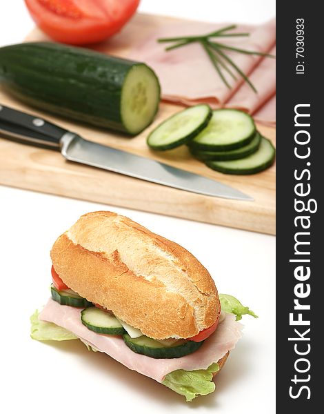 Ham,tomato,cucumber and salad sandwich isolated on white