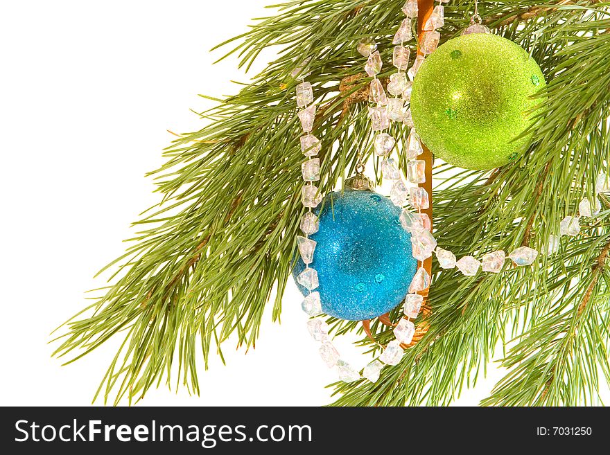 Fir branch decorated with two christmas balls and garland. Fir branch decorated with two christmas balls and garland