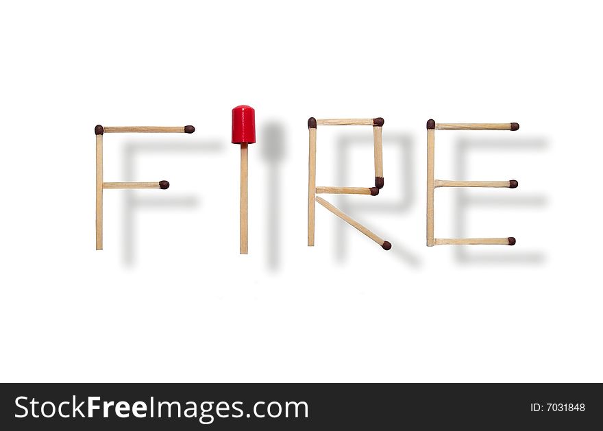 Word fire made of individual matches put together on white background and a red cap giving a sense of alertness