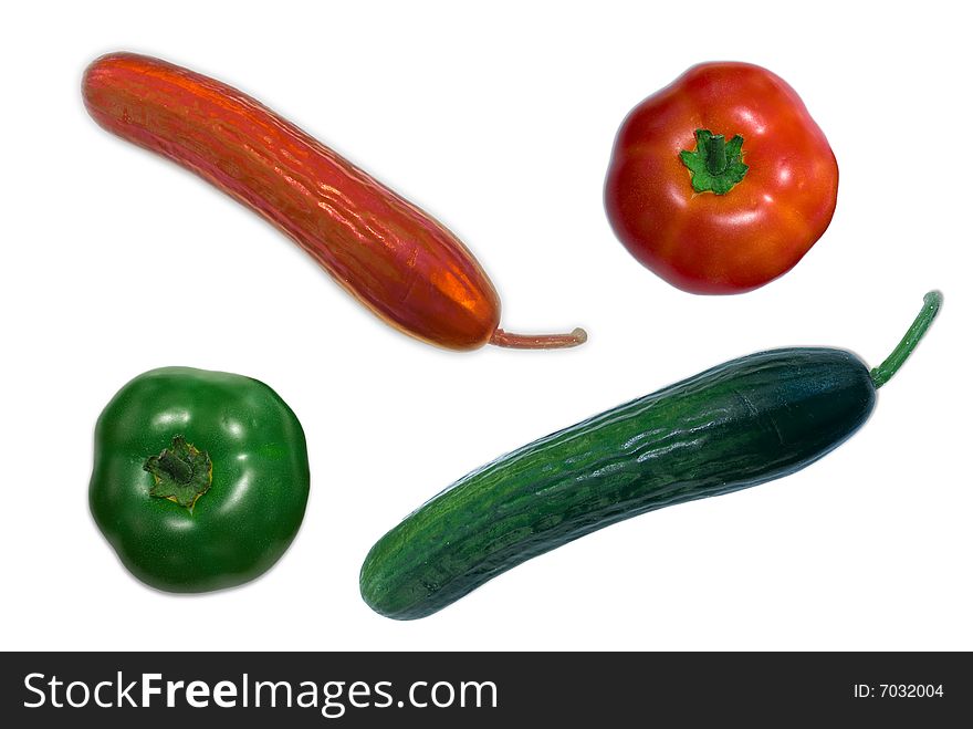 Isolated red and green tomatoes and cucumbers indicating color invertion