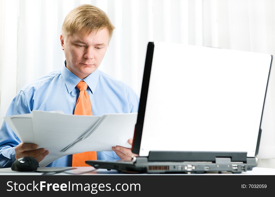 Young businessman work on laptop. Young businessman work on laptop