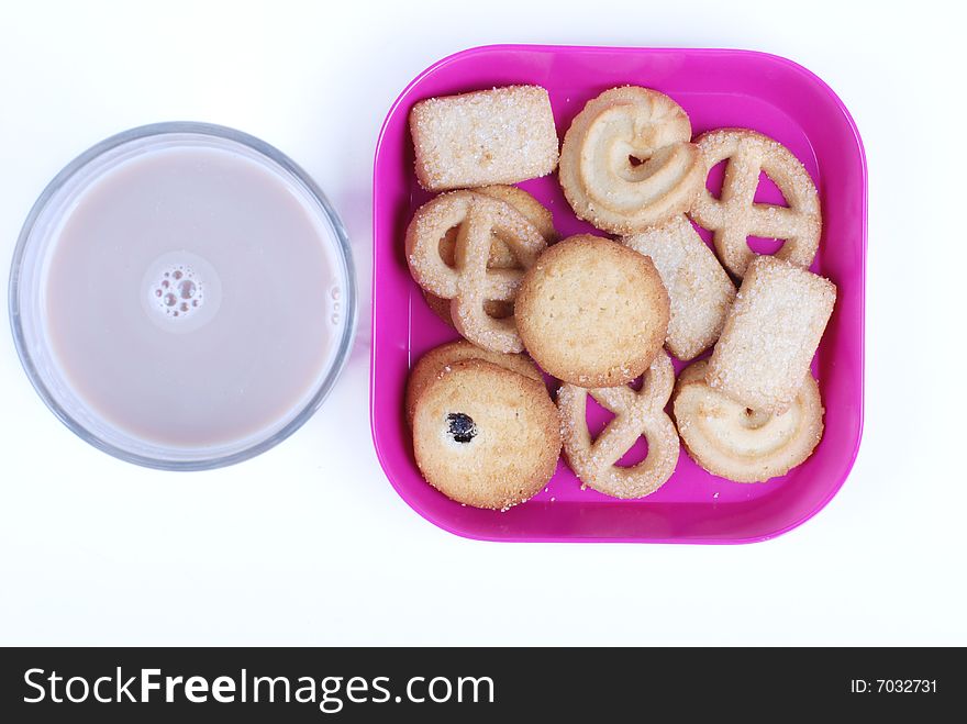 A plate of cookies and cup of milk-chocolate on white background. A plate of cookies and cup of milk-chocolate on white background