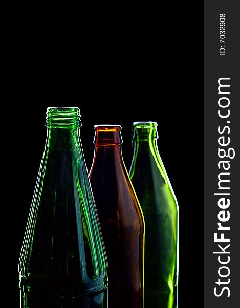 Empty bottles isolated on black