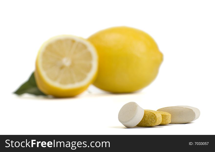 A photo of lemon and pills. A photo of lemon and pills
