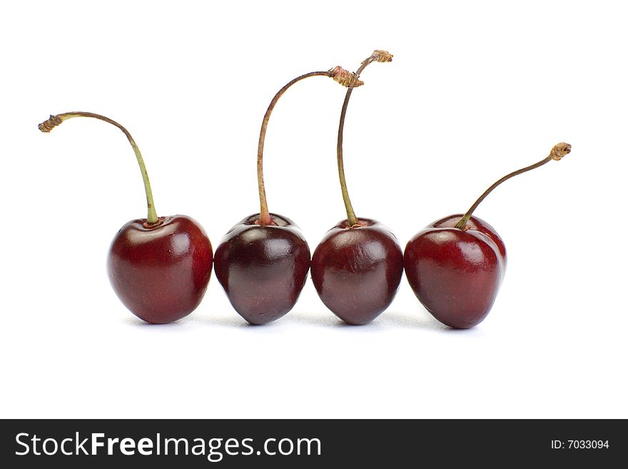 A photo of four fresh cherry