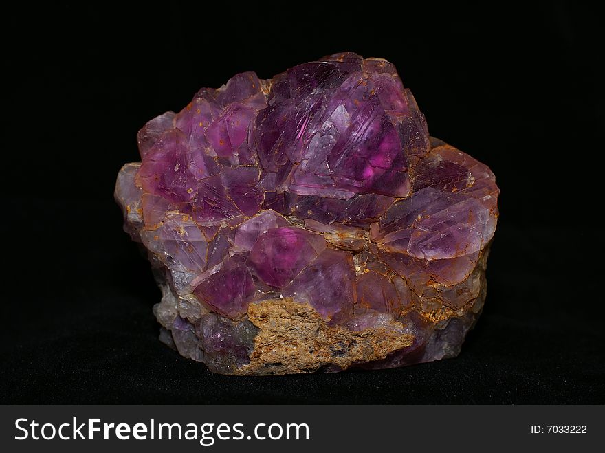 Natural amethyst crystallized structure on black background