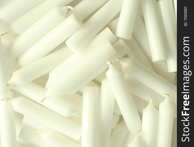 many of small white candles closeup. many of small white candles closeup
