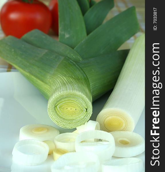 Leek it is cut on a plate closeup. Leek it is cut on a plate closeup