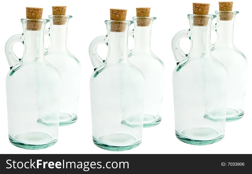 Bottle made of glass with corks, against a white background isolates