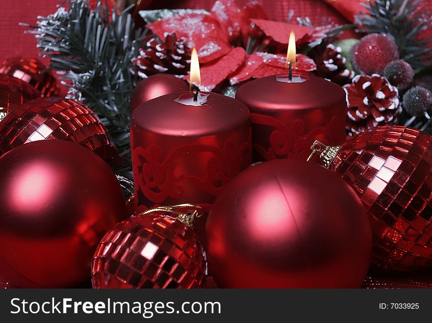 Closeup shot of red candle in christmas decoration. Closeup shot of red candle in christmas decoration