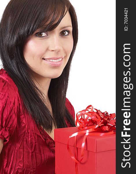 Portrait of a beautiful young brunette woman holding gift box at a celebration isolated on white background. Portrait of a beautiful young brunette woman holding gift box at a celebration isolated on white background