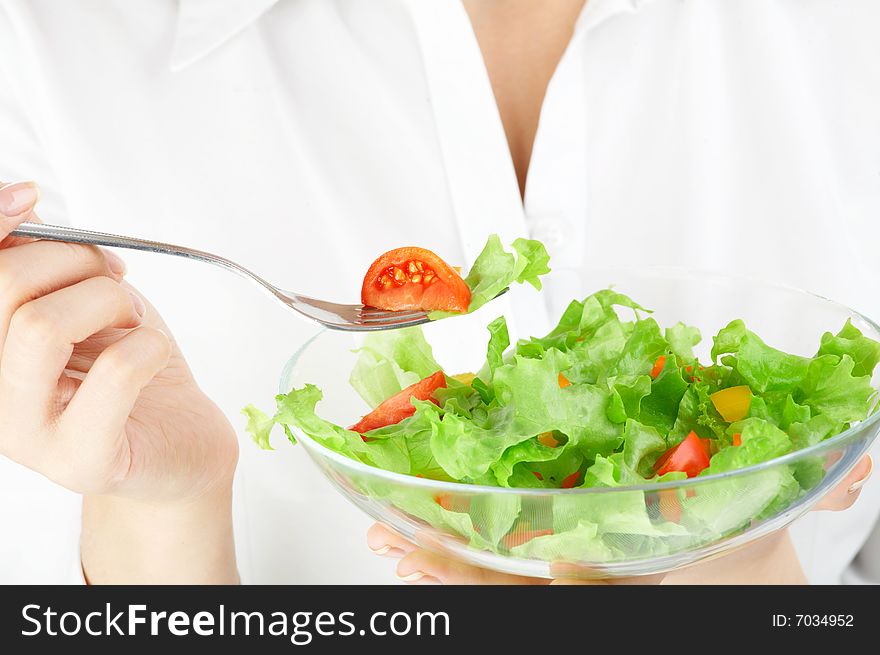 Close up of a plate with salad in hands. Close up of a plate with salad in hands