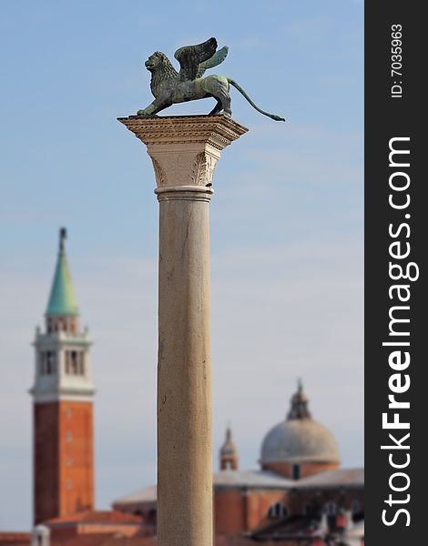 Column with lion-symbol of Venice in front of San Giorgio Maggiore church in Venice, Italy. Column with lion-symbol of Venice in front of San Giorgio Maggiore church in Venice, Italy.