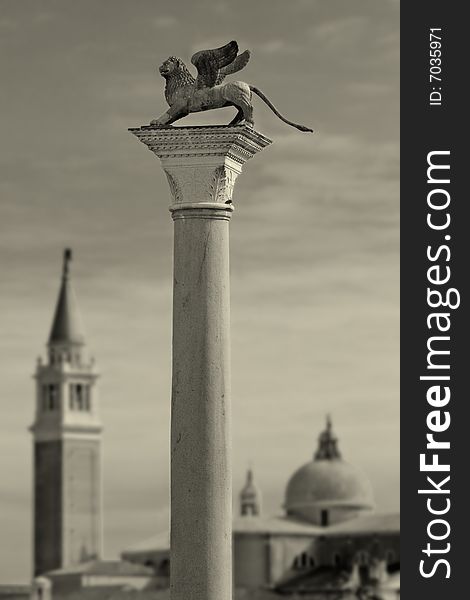 Column with lion-symbol of Venice in front of San Giorgio Maggiore church in Venice, Italy. Column with lion-symbol of Venice in front of San Giorgio Maggiore church in Venice, Italy.