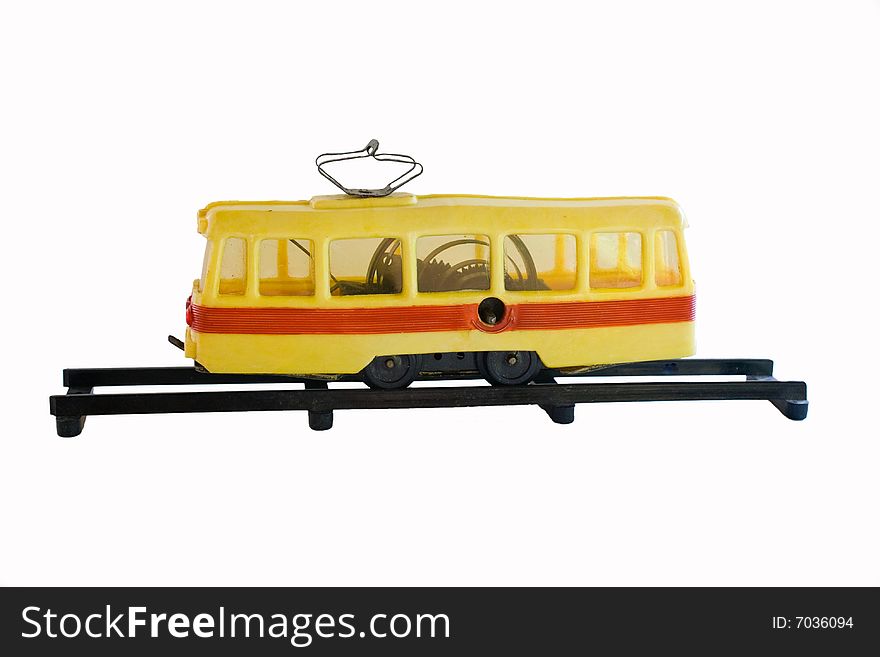 Old tram toy isolated on white