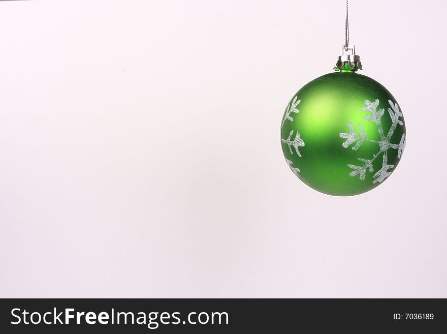 One green christmas ornaments hanging. One green christmas ornaments hanging