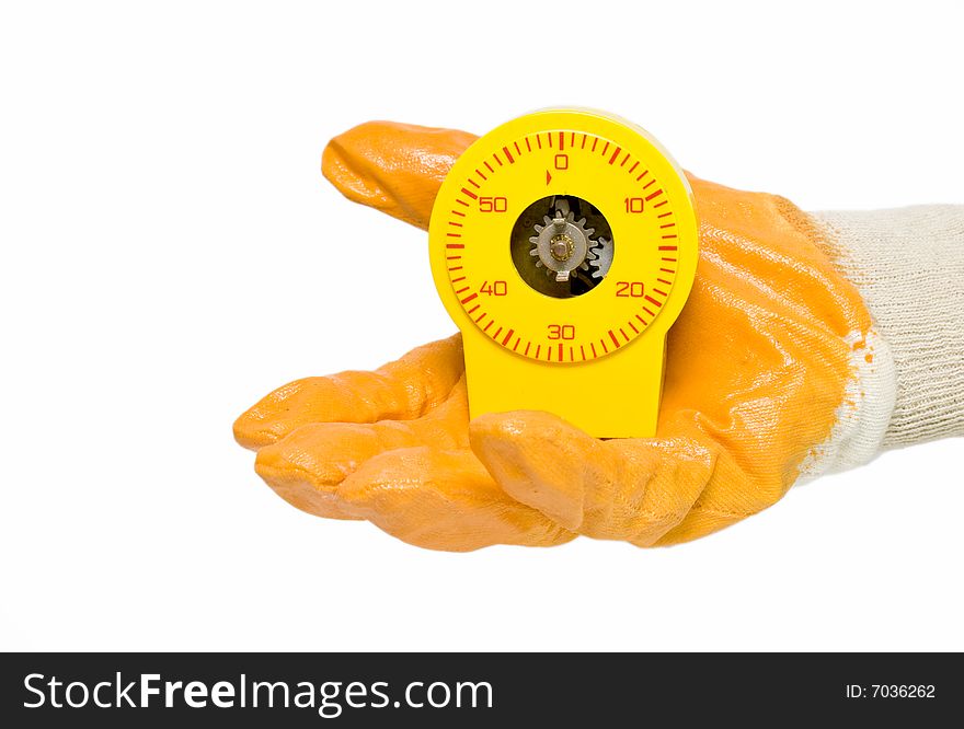 Hand with yellow glove giving timer. Hand with yellow glove giving timer