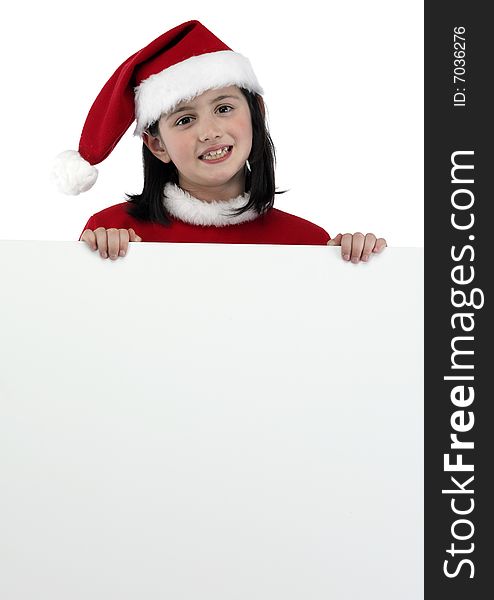 Little girl with santa clothes holding a white banner isolated on white. Little girl with santa clothes holding a white banner isolated on white