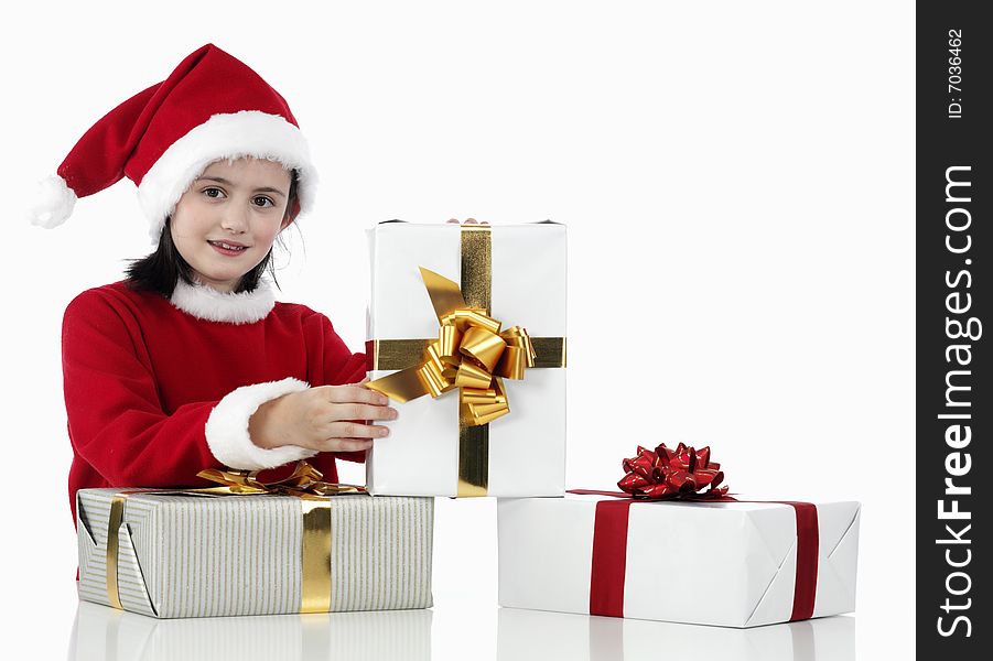 A little girl and xmas presents on white background. A little girl and xmas presents on white background