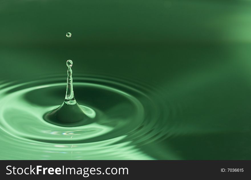 Water droplets close up in green. Water droplets close up in green