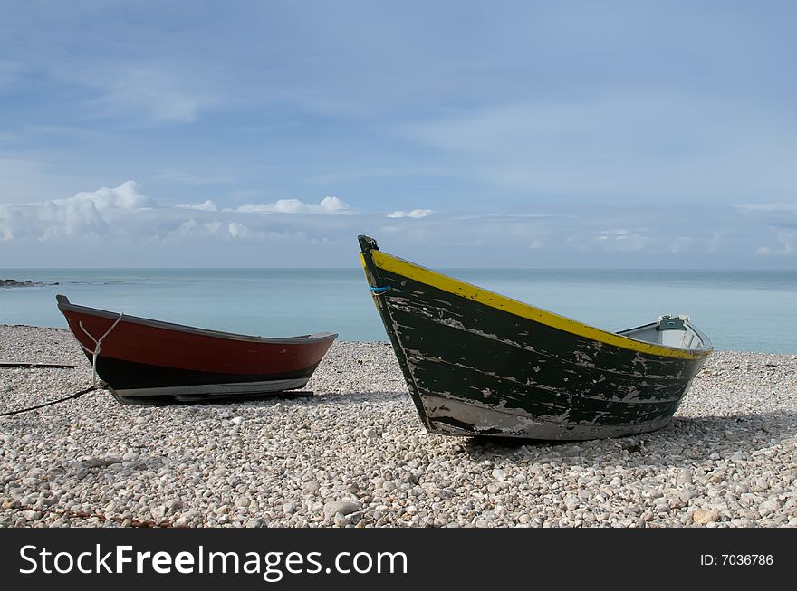 Small boats lying on the beach in Yport, France. Small boats lying on the beach in Yport, France