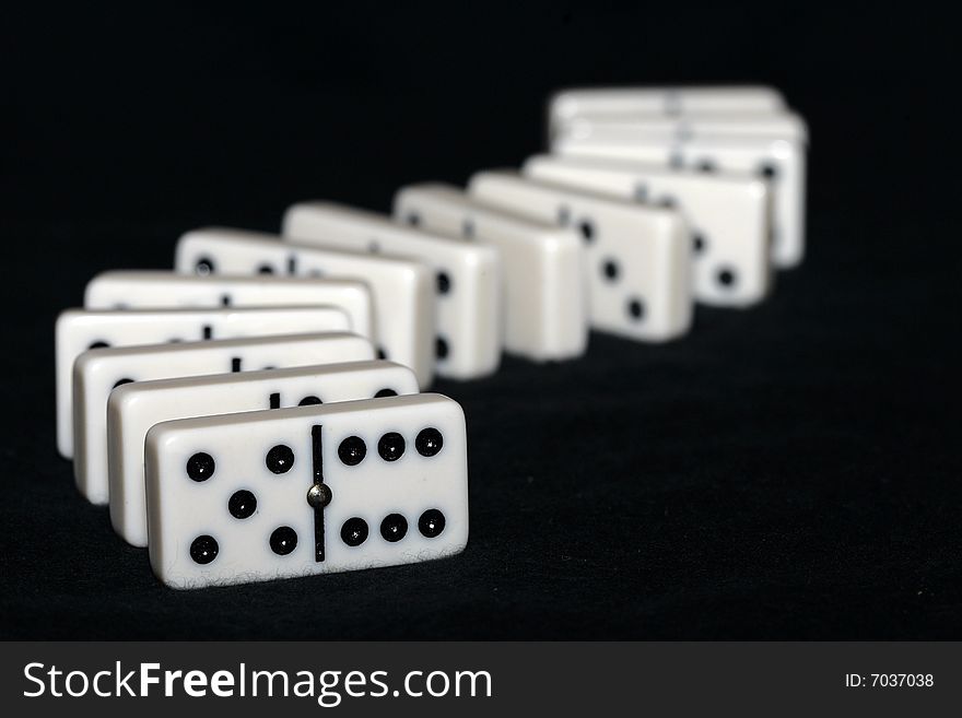 Curved row of arrangened dominoes. Curved row of arrangened dominoes