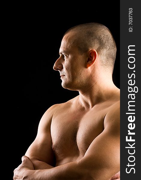 Muscular man isolated on black
