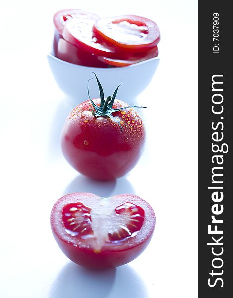 Fresh tomatoes on white background