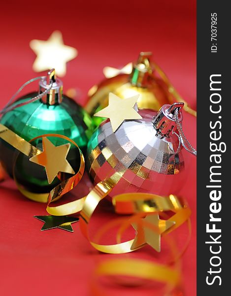 Christmas balls and decorations on red background