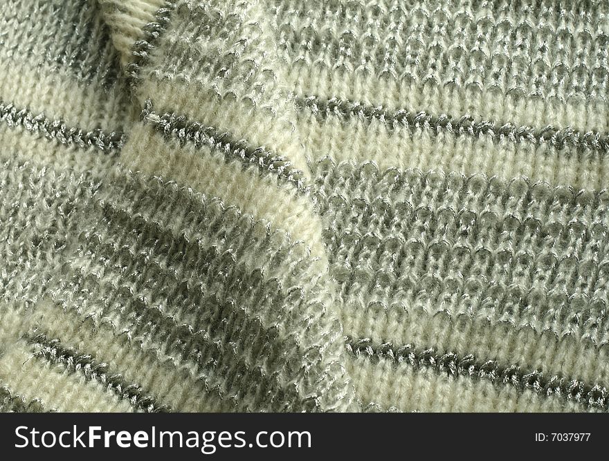 Knitted wool with a silver thread, closeup