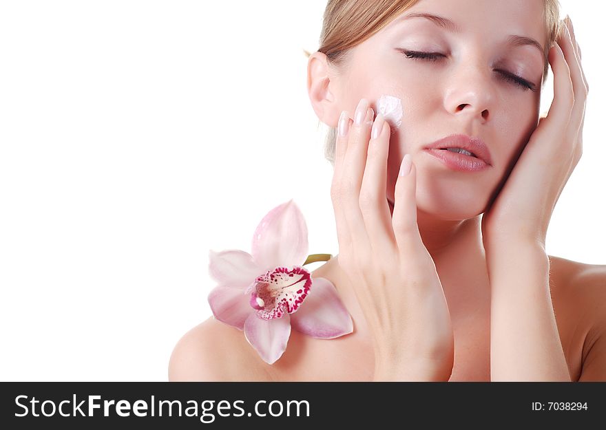 Face of beautiful young woman with delicate orchid. Face of beautiful young woman with delicate orchid