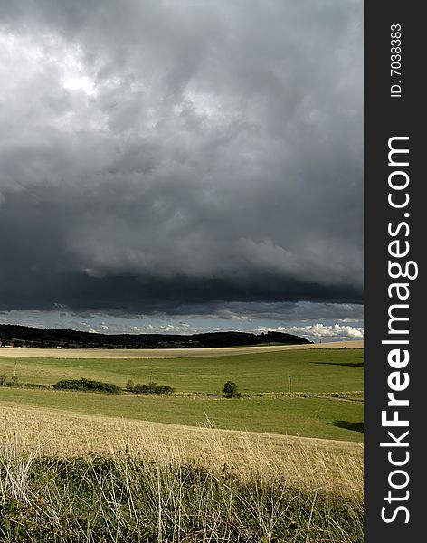 Summer landscape and heavy clouds