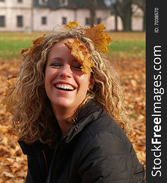 Happy girl in autumn park