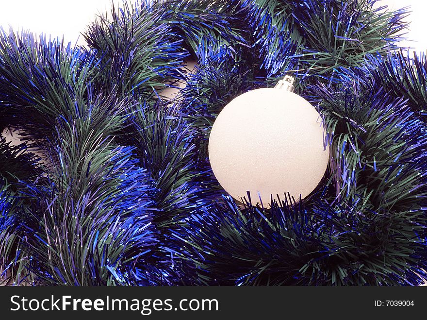 Christmas sphere and tinsel as a background. Christmas sphere and tinsel as a background