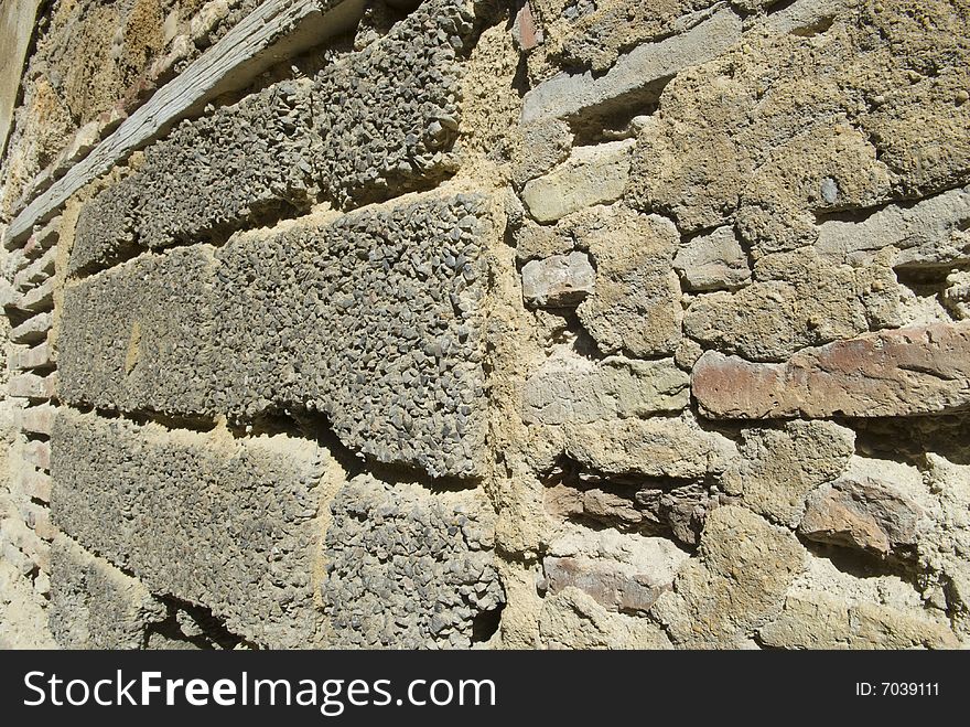 Stone rock and rouhg cement block wall with a wood beam detail. Stone rock and rouhg cement block wall with a wood beam detail