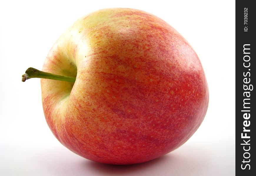 A red gala apple on a white background