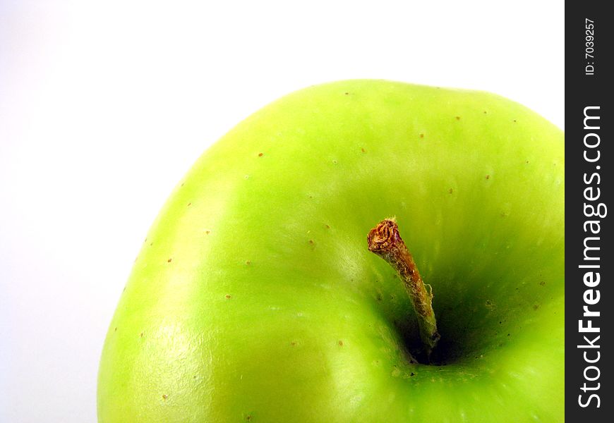 Close-up of a golden delicious apple on white background