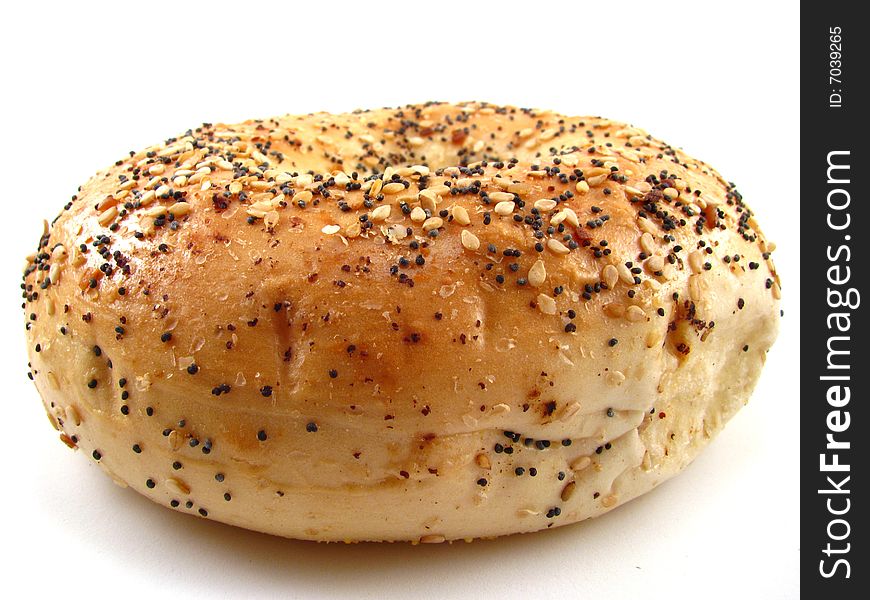 An everything bagel on a white background