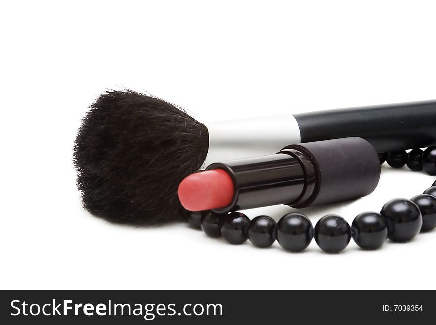 Brush and lipstick, isolated on the white background. Brush and lipstick, isolated on the white background