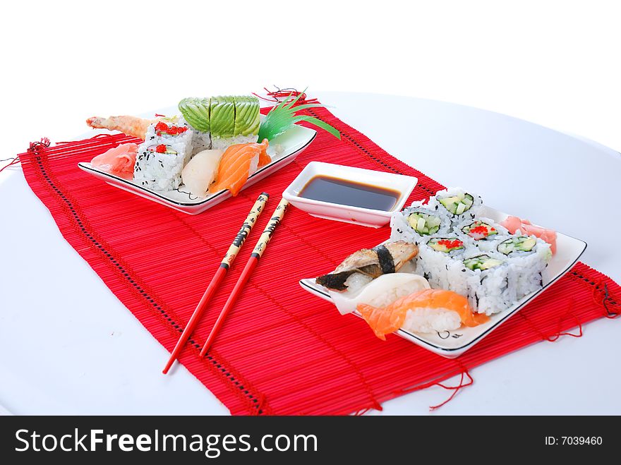 Set of rolls and sushi on several plates. Set of rolls and sushi on several plates