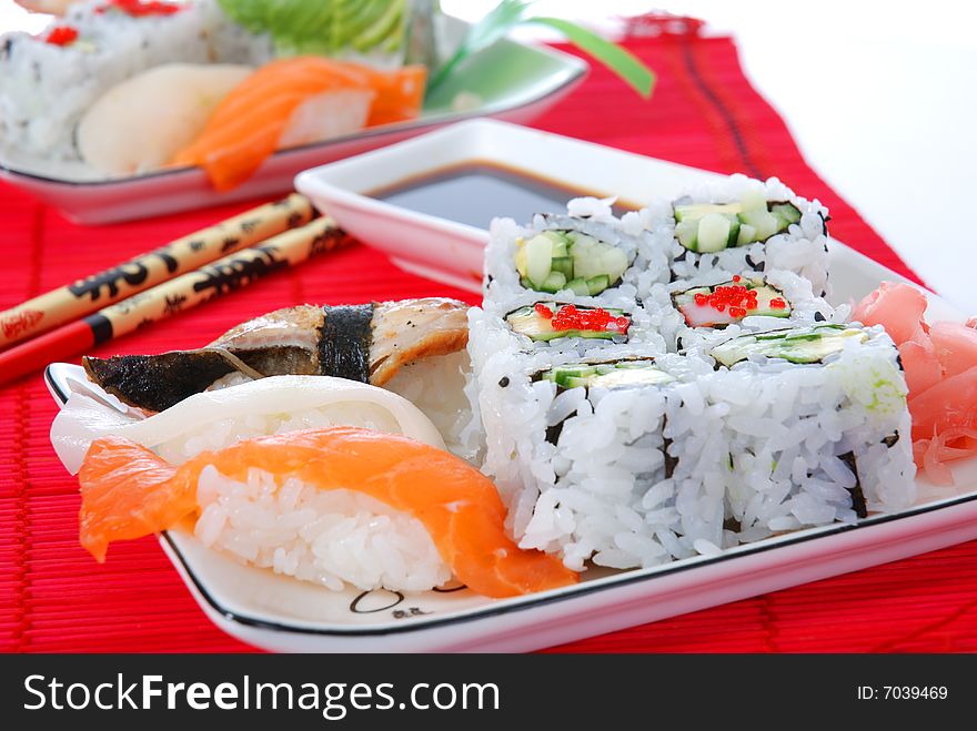 Set of rolls and sushi on several plates. Set of rolls and sushi on several plates