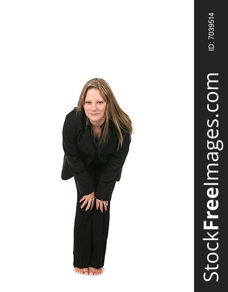 Professional woman in black bending forward with hands on her knees. Professional woman in black bending forward with hands on her knees