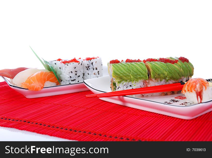 Set of rolls and sushi on several plates. Set of rolls and sushi on several plates