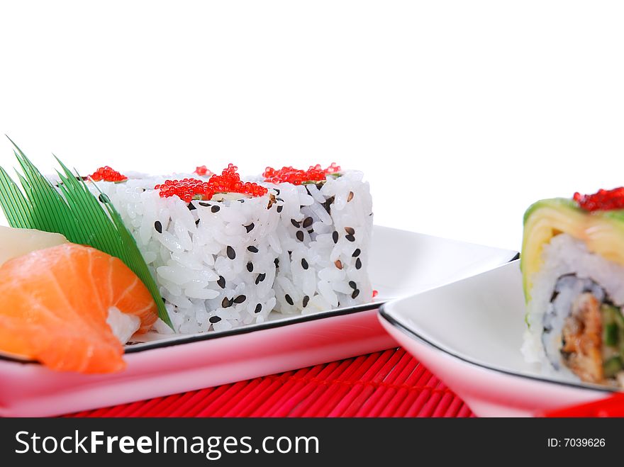 Set of rolls and sushi on several plates. Set of rolls and sushi on several plates