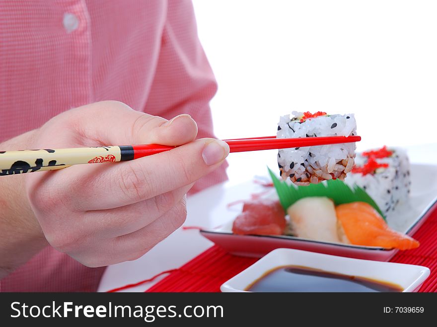 Set of rolls and sushi on several plates. Set of rolls and sushi on several plates