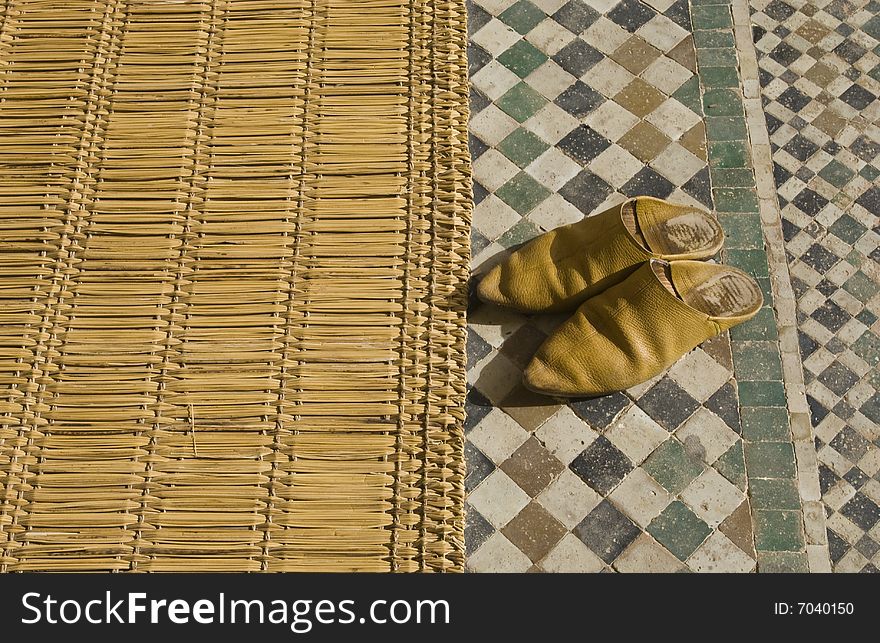 Old Moroccan (baboosh) shoes outside a mosque. Old Moroccan (baboosh) shoes outside a mosque