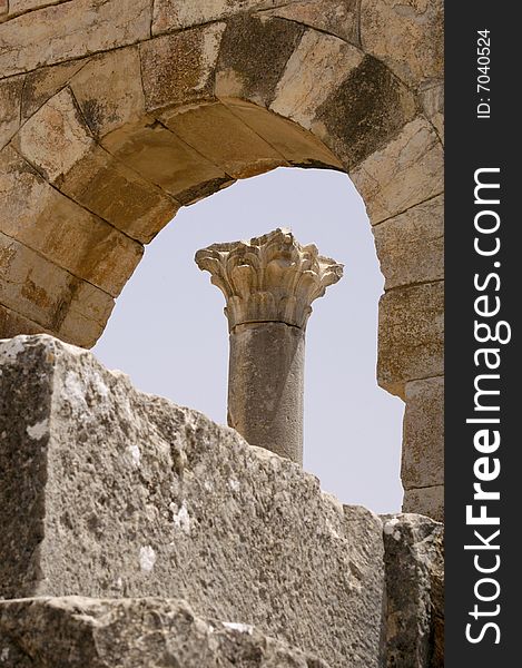 Roman columns framed in an arch at Volubilis, Morocco. Roman columns framed in an arch at Volubilis, Morocco