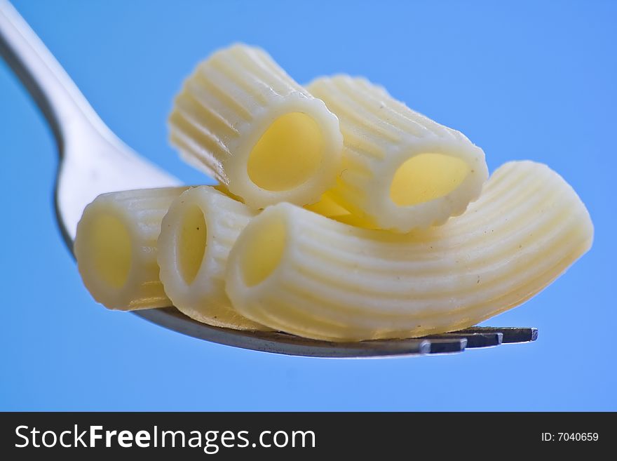 Fork fresh pasta with sauce, tomatoes and oregano