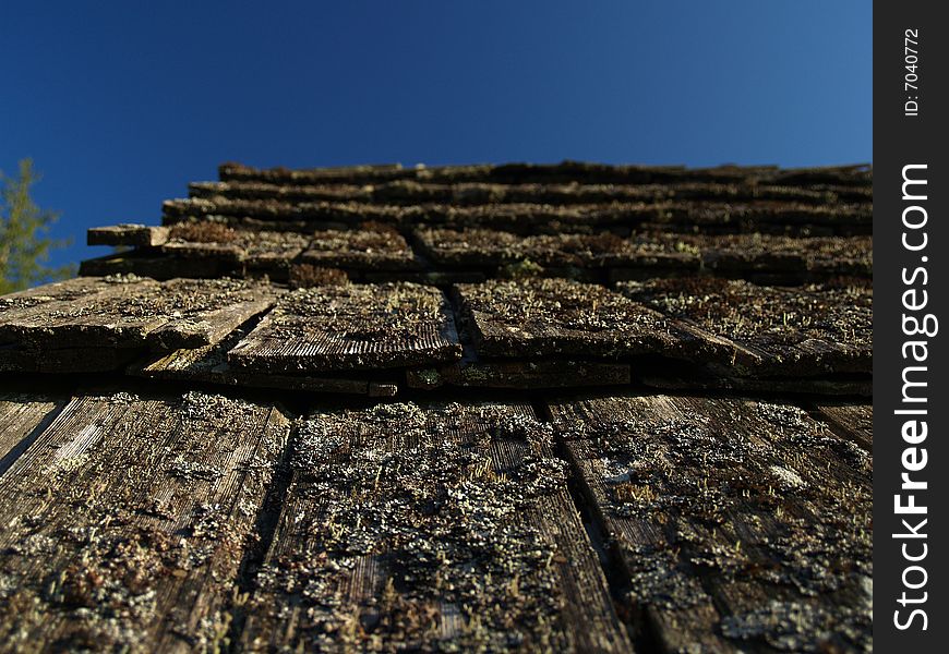 The shingle roofing of a barn. The shingle roofing of a barn.