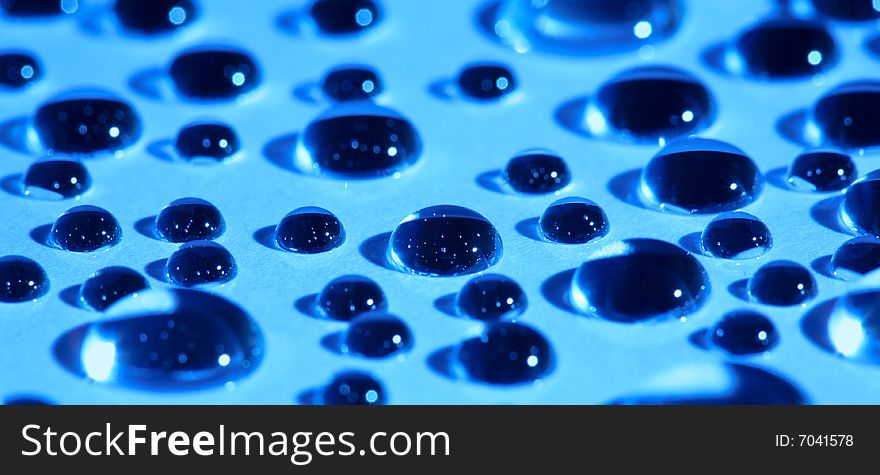 Water Drops On Blue Glass